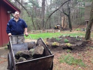 Karl Harvests Rocks from Cottage Garden