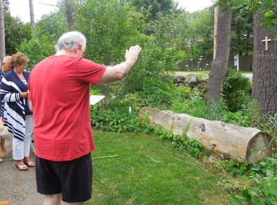 Fr. Ken Blesses Each Wooden Cross