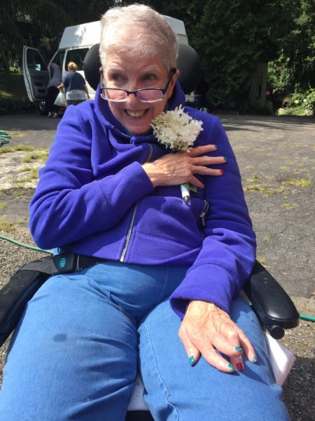 Eileen Holds the Hydrangea Bloom Close to Her Heart