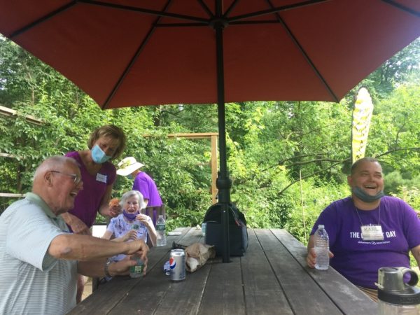 A Family Enjoys a Picnic at our Accessible Table