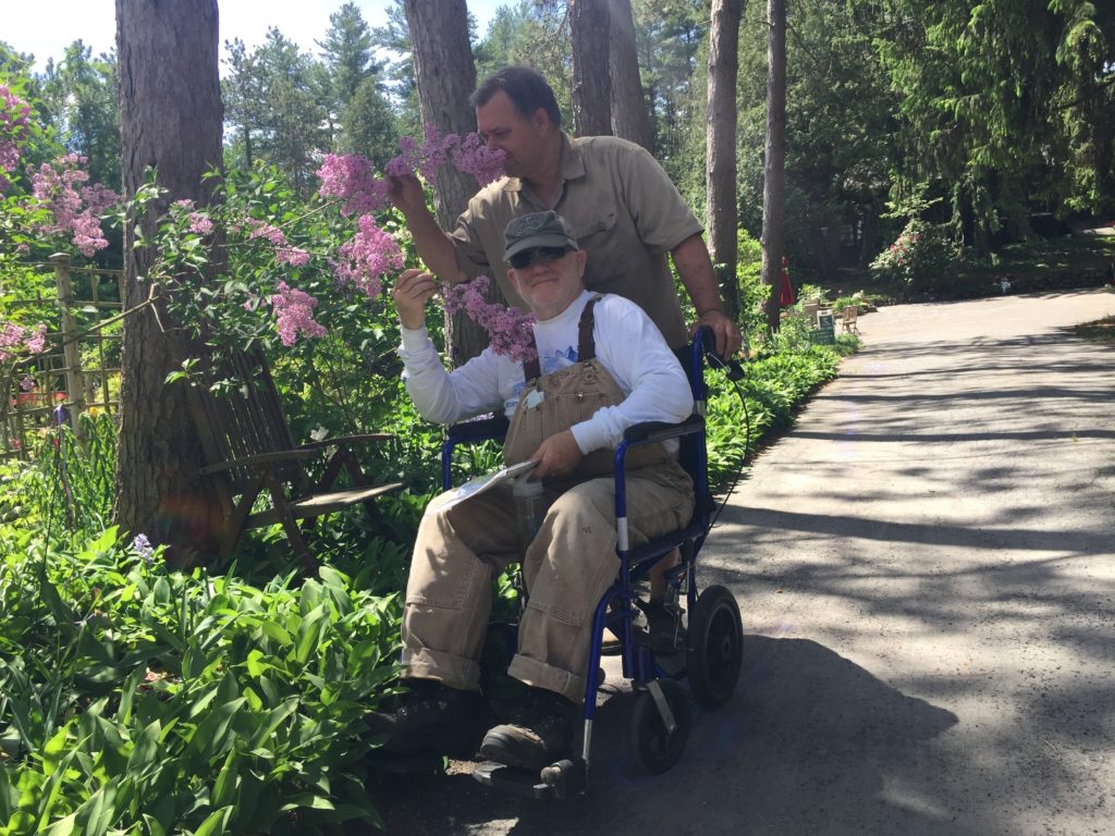 Karl and John smell the lilacs