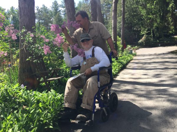 Karl and John smell the lilacs