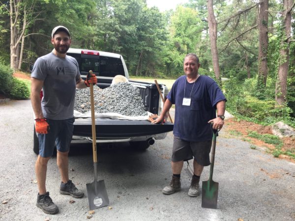 Ryan and Karl transfer gravel into pickup truck
