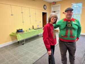 Linda and Karl, in their Ugly (Cute!) Holiday Sweaters