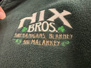 Logo: Nix Bros. Shenanigans, Blarney and Malarkey, with shamrock design