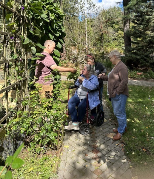 Karl offers guests to smell some fresh mint leaves.