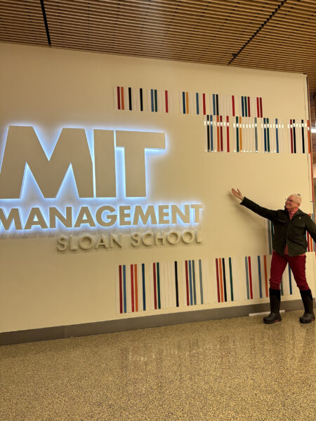 Mary poses at the MIT Management Sloan School Sign