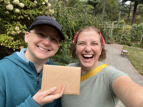 Mary E MacDonald receives donation envelope from Jessica Yurwitz, Owner,
Slow River Studio