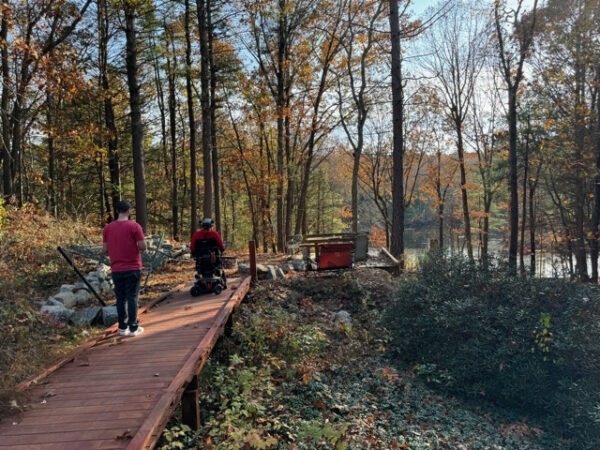 Nick manages the overhead drone camera as they approach the Lily Pond Overlook.