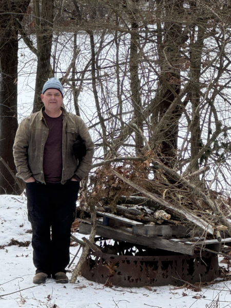 Karl stands next to Bonfire #2 of 3 (ready for 1/17/26 burn)