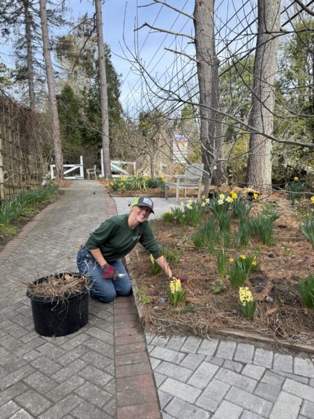 Julie, Garden Guru, weeds garden beds.